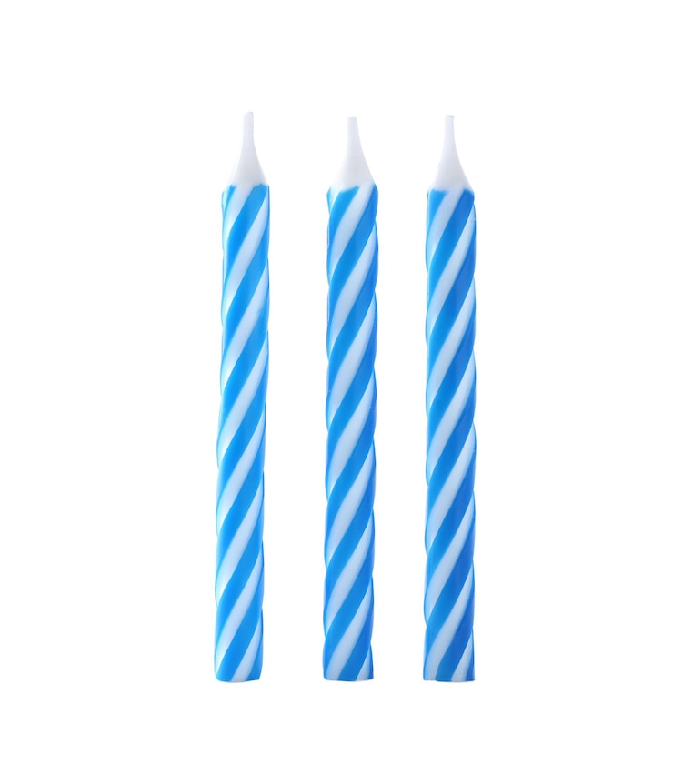 Photo blue striped birthday candles isolated on white