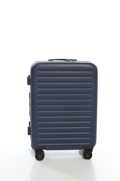 Blue 
suitcase on white background