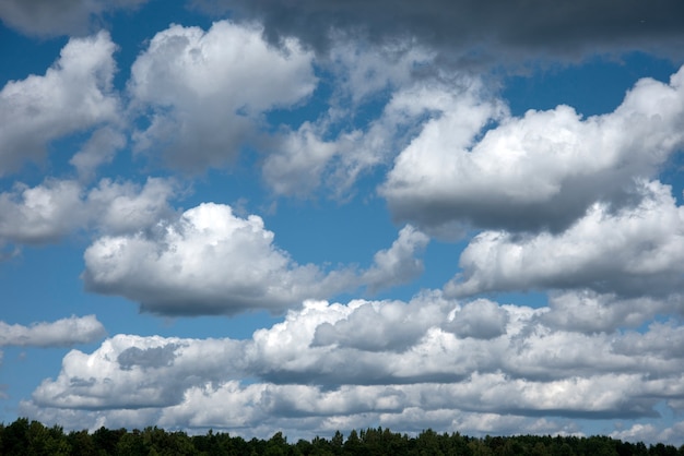 Blue summer sky white cumulus clouds background