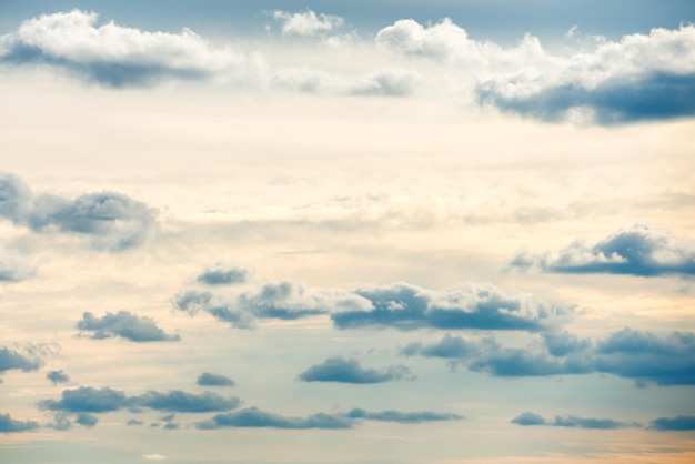 Blue sunset sky background with white clouds