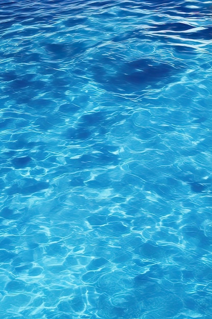 Blue swimming pool rippled water background