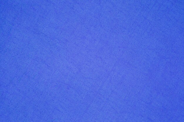 Blue synthetic fabric closeup uniform texture background