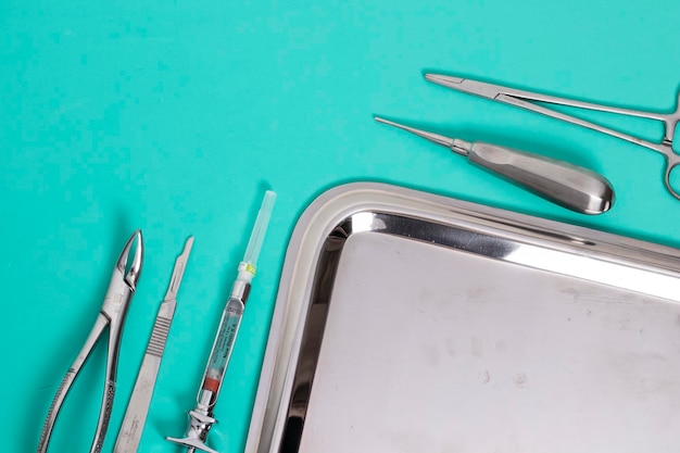 Photo blue table of tools for dental surgery