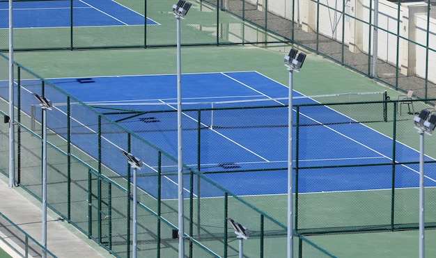 Blue tennis court in the resort