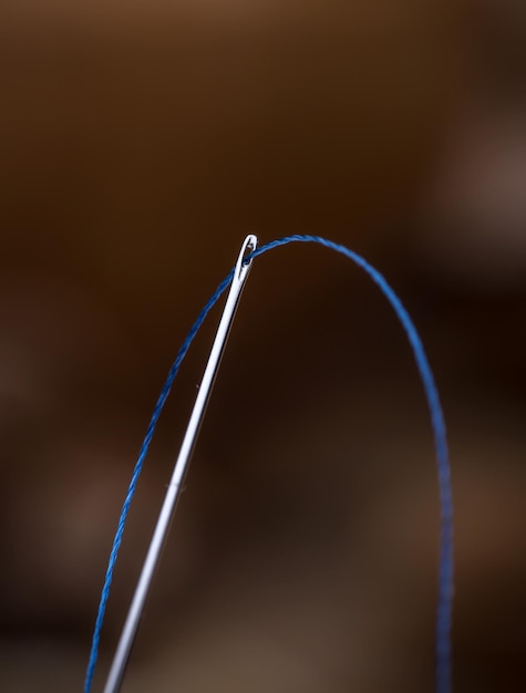 Blue thread and needle