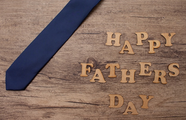 Photo blue  tie in a wood for father's day