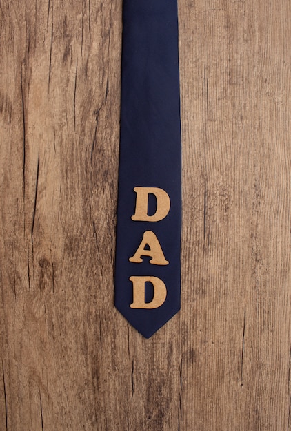 blue tie in a wood for father