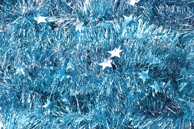Blue tinsel texture. New year texture. Christmas background. Decorations