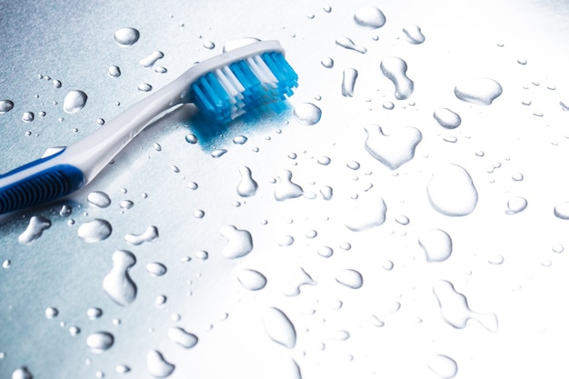 Blue toothbrush on a gray  closeup