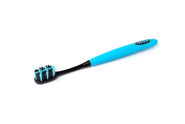 Blue toothbrush with black bristles isolated.
