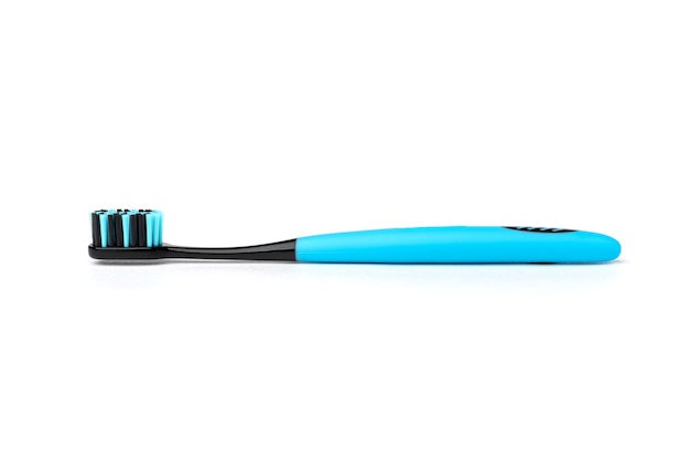 Blue toothbrush with black bristles isolated.