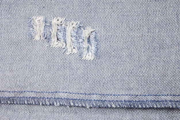 Photo blue torn denim jeans texture