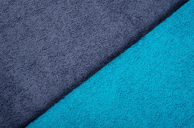 Blue towel fabric texture, top view photo.