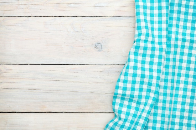 Blue towel over wooden kitchen table