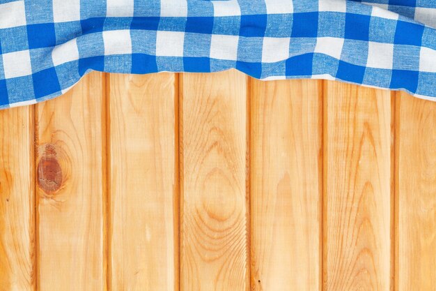 Blue towel over wooden kitchen table