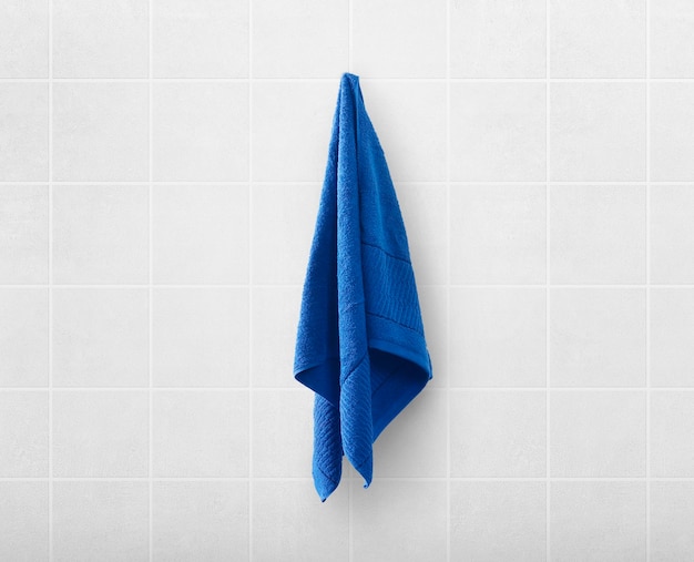 Blue towels on hanger in toilet bathroom