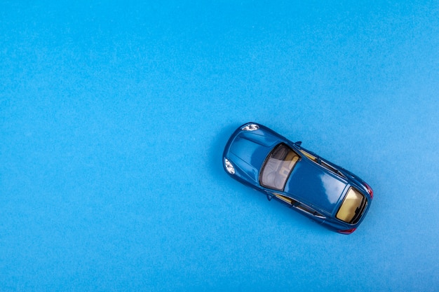 Blue toy car on blue colored