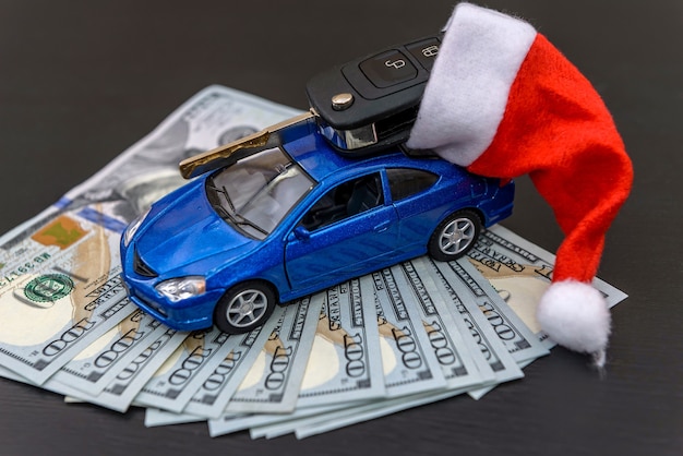 Blue toy car with real key and santa hat