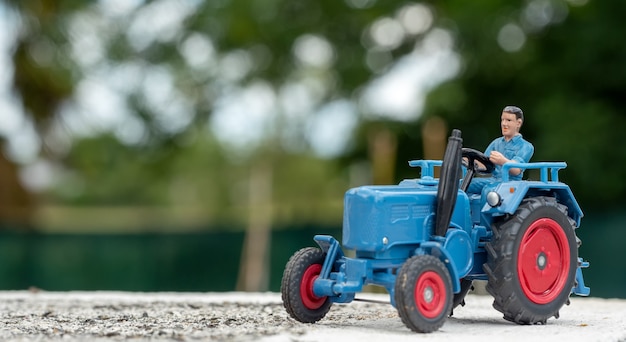 A blue tractor toy model