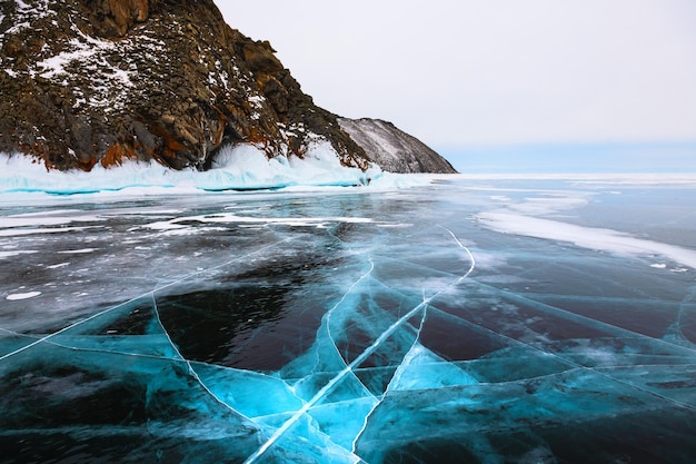 Blue transparent ice on Baikal lake Siberia Russia Beautiful winter landscape Famous travel destination