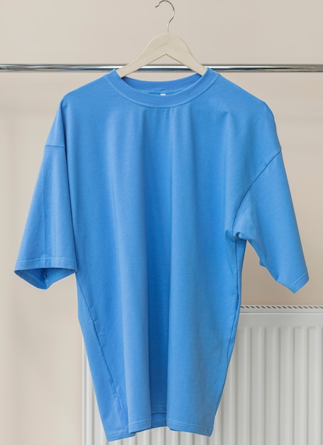 Blue tshirt on hanger ready for your own graphics