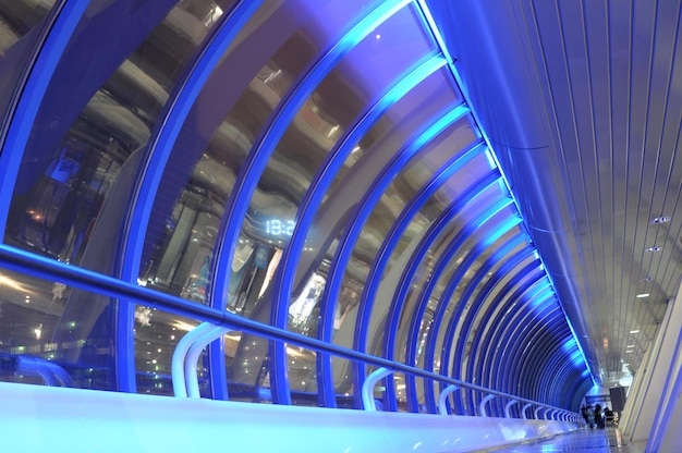 A blue tunnel with a sign that says " the time " on it.