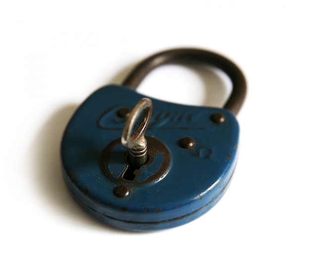 Photo blue vintage metal padlock on white