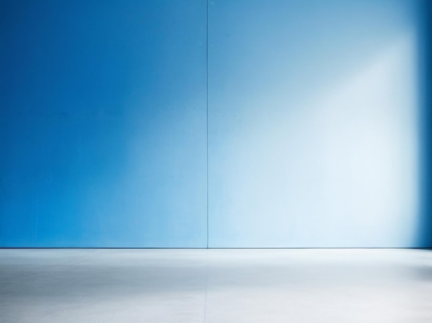 Blue wall in an empty room with concrete floor