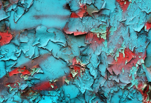 A blue wall with a blue and red paint that says'rust'on it '