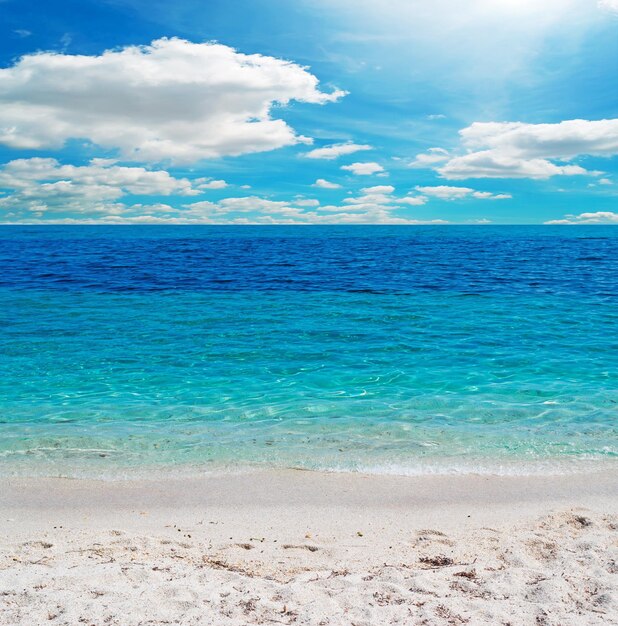 Blue water under a cloudy sky in Sardinia