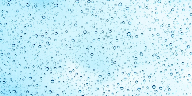 Blue water drops on glass or rain drop background