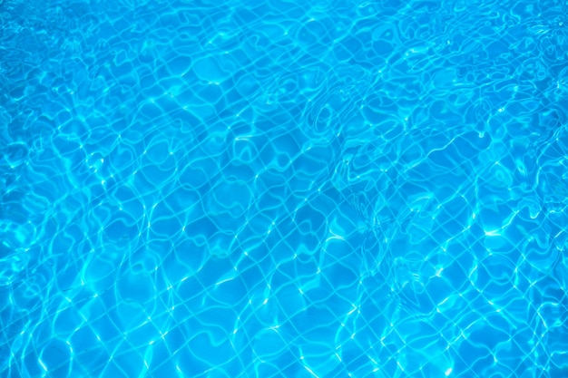 Photo blue water pattern in swimming pool.