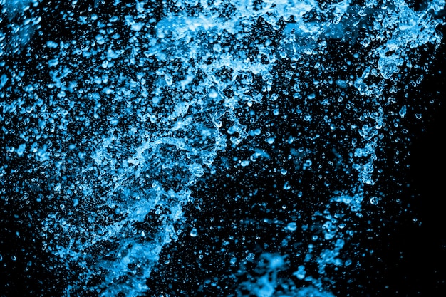 blue water splash on the black background.