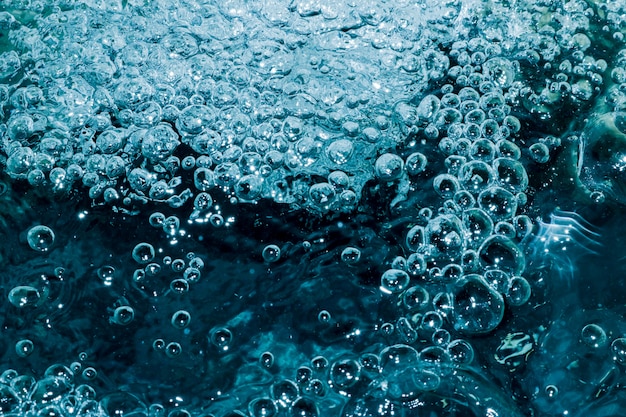 The blue water that creates many small bubbles inside gives a fresh and ripple feel, suitable for design and background.