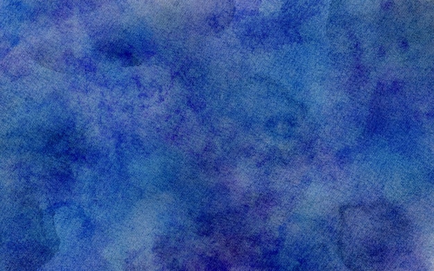 Blue watercolor background with paper texture vintage watercolor paint splash and stains in elegant blue