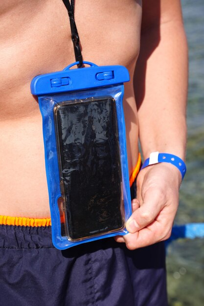 Photo blue waterproof smartphone case for taking pictures underwater. high quality photo