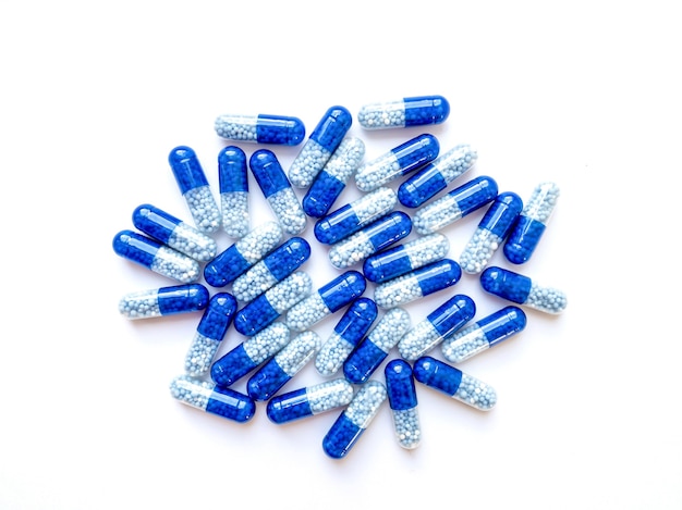 Blue-white capsules isolated on white background.Health concept.