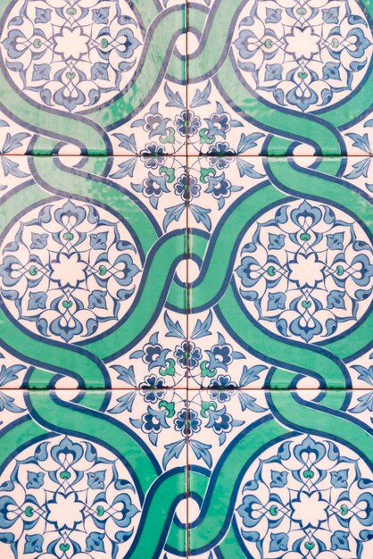 Blue and white ceramic tile with floral pattern