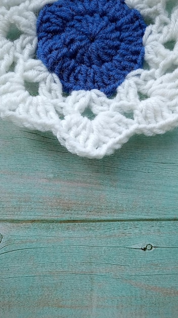 Blue white crochet elements and orchid Crochet texture place for an inscription adapted for mobile