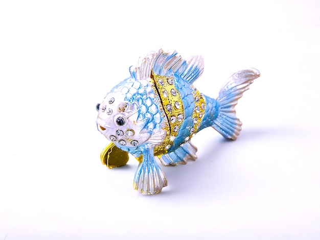 Blue and white decorative fish statue animal decoration with ornaments on a white background