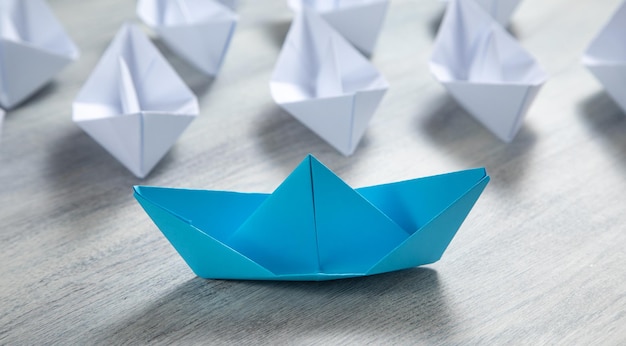 Blue and white paper boats Business concept