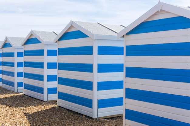 Blue and white striped beach huts at the seaside