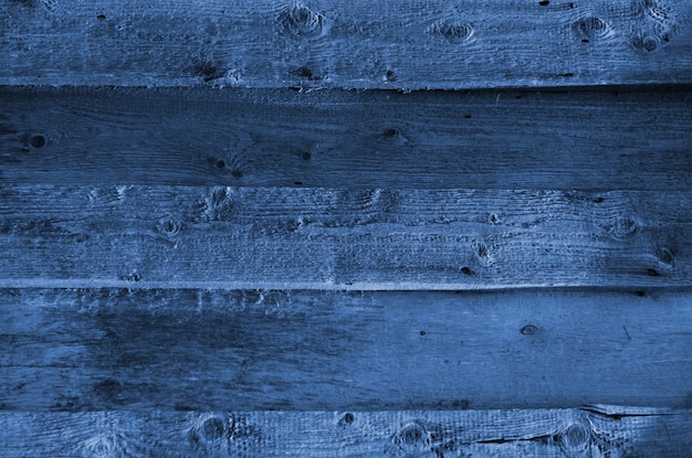 The blue wood texture with natural patterns. Classic Blue color. Color of the year 2020. Trendy color.