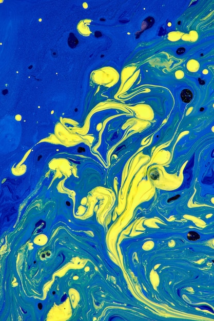 Blue and yellow abstract hand painted background, liquid acrylic painting . Contemporary art concept.