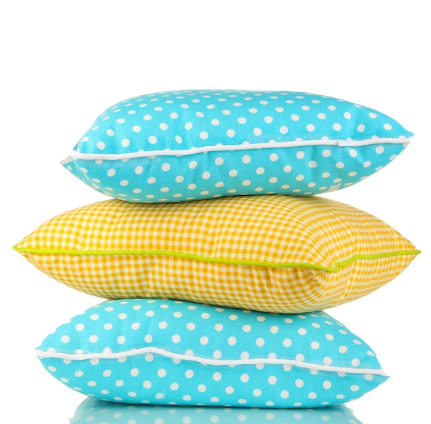 Blue and yellow bright pillows on white