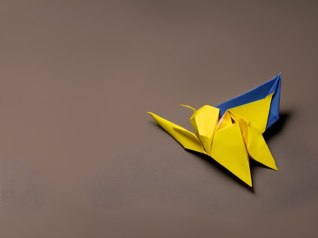 A blue and yellow origami bird with the word st. petersburg on the side.