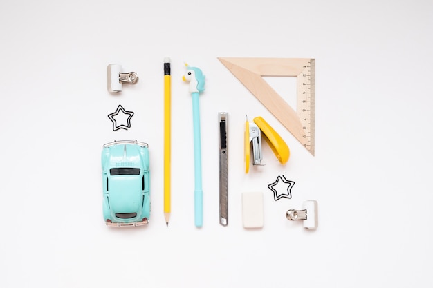 Blue and yellow school supplies isolated on white background