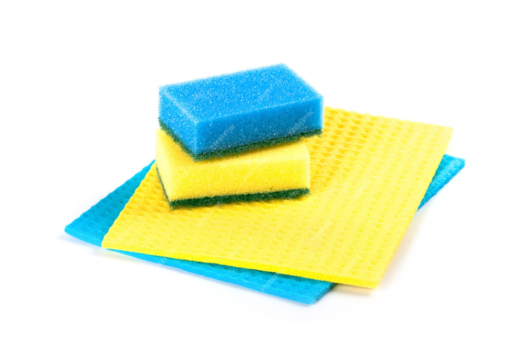 Premium Photo  Blue and yellow sponges isolated on white background