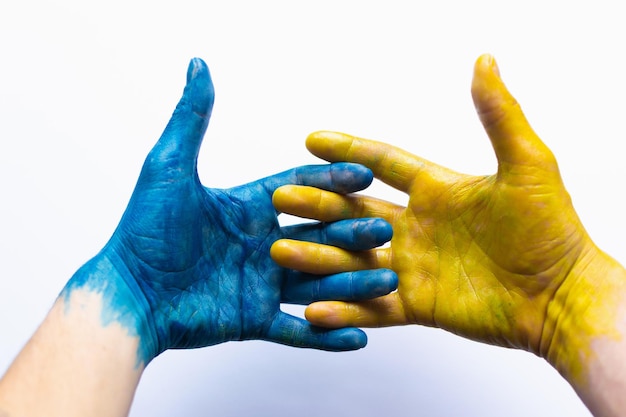 Blue and yellow ukrainian hands isolated symbolic hands