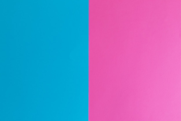 Blueand pink pastel color paper surface with space for text